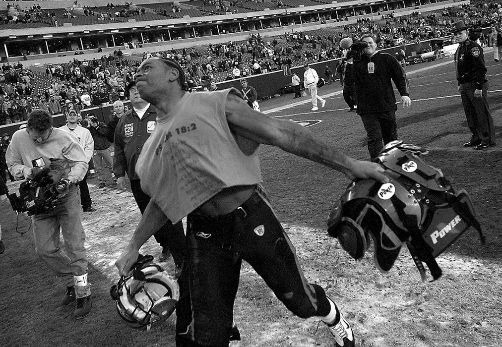 Award of Excellence, Photographer of the Year - Michael E. Keating / Cincinnati EnquirerDillon made good on his threat tossing his shoulder pads into the stands.  His helmet and shoes went there as well.