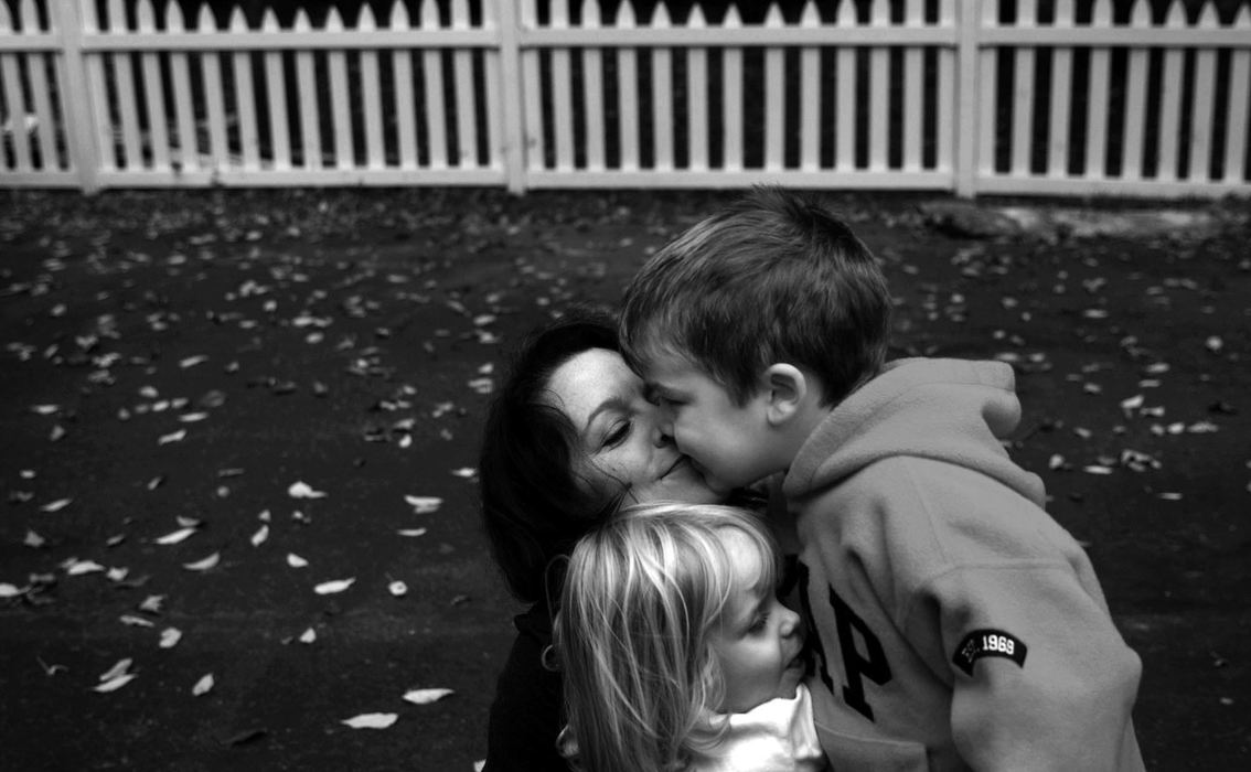 First Place, Photographer of the Year - Dale Omori / The Plain DealerSophia Augier gets hugs from Marcel and Margaux.  It is rare that Marcel, who suffers from autism, shows signs of affection.