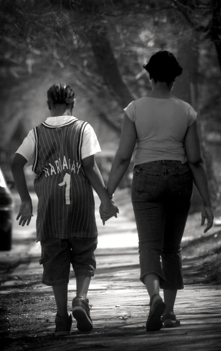 First Place, Photographer of the Year - Dale Omori / The Plain DealerMichele Noble, strolling home after school with Robert, often has mixed emotions about her son--infuriated with him on many occasions, but still protective of the youngest of her three boys.