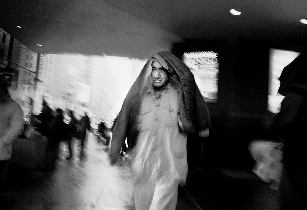 Second Place, Photographer of the Year - Greg Ruffing / FreelanceA man shields himself from the rain as he emerges from the New York City subway at Penn Station in midtown Manhattan.