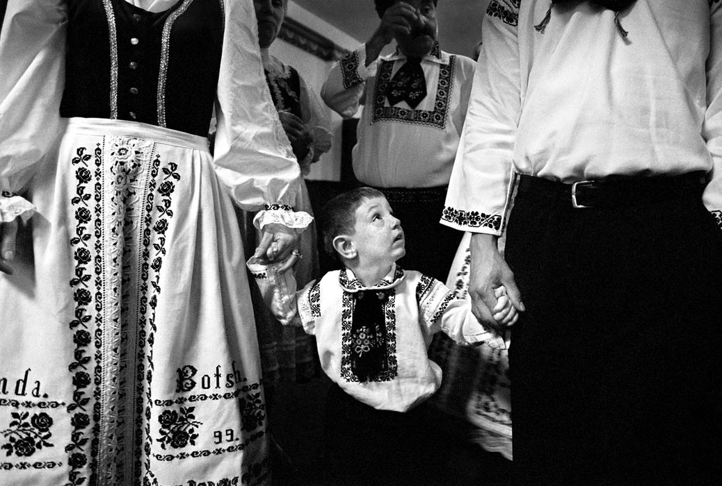 Second Place, Photographer of the Year - Greg Ruffing / FreelanceDressed in the traditional Saxon "trachten" (costumes) of their native villages in the Transylvania region of Romania, Amanda (left) and Horst Botsch lead their son Zachary, age 2, in a processional of families during Trachtenball festivities in Cleveland. As the Transylvanian Saxon culture has diminished after decades of communist rule in Romania and the influences of American society, younger generations such as Amanda and Horst must shoulder the responsibility of keeping the traditions alive for their children's generation.