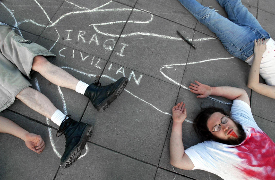 Third Place, Photographer of the Year - Fred Squillante / The Columbus DispatchTim Lemmon, bottom right, joins others protesting war against Iraq by pretending to be civilian casualties during a demonstration at Ohio State University.