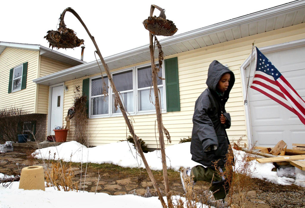 Third Place, Photographer of the Year - Fred Squillante / The Columbus DispatchWasihun, unaccustomed to the Ohio cold, hurries to the family van.