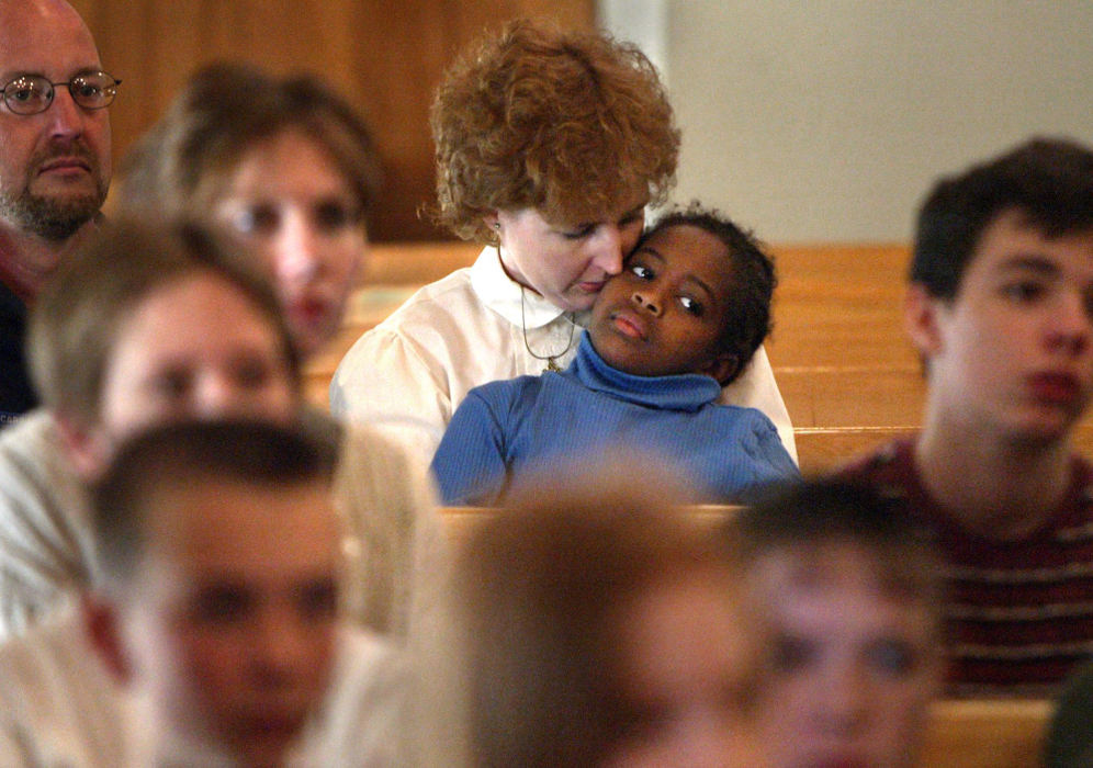 Third Place, Photographer of the Year - Fred Squillante / The Columbus DispatchKristian sticks close to her new mom, Robyn, as they listen to a spring presentation at the Johnstown Home School.