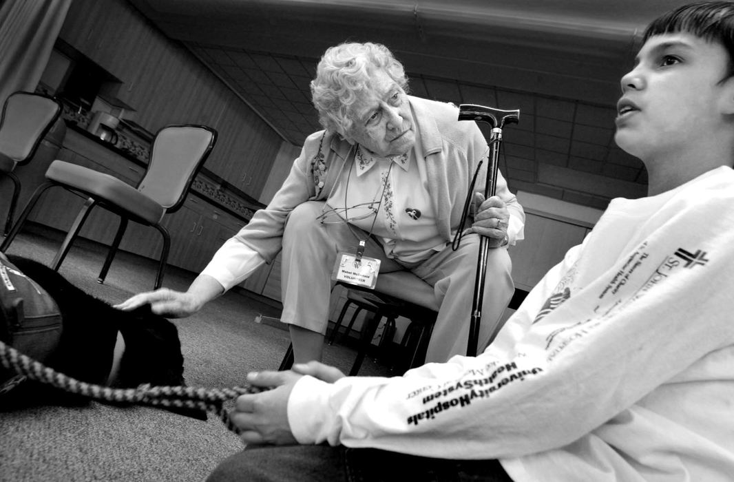 Third Place, Photographer of the Year - Fred Squillante / The Columbus DispatchMabel McDonald listens as Eddie Hicks, right, talks about training Fonzie. McDonald is a resident of Wesley Glen retirement community, where the students take their dogs once a month.