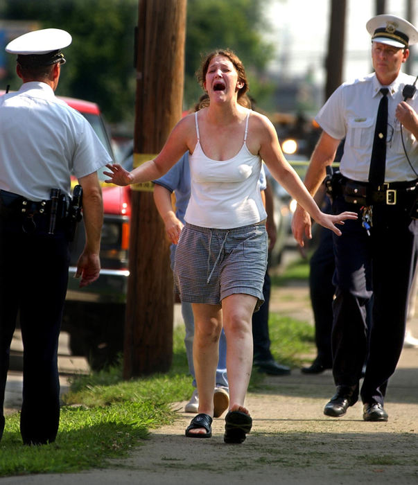 Third Place, Spot News over 100,000 - Steven M. Herppich / Cincinnati EnquirerThe mother of a two-year-old boy reacts to learning that her child died after being struck by a truck while crossing the street on the 6600 block of Vine Street in Elmwood Place.                               