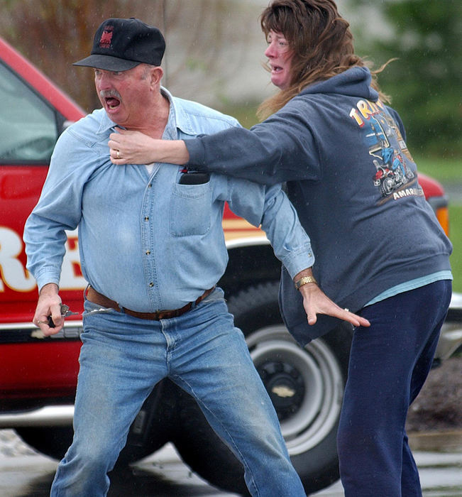 First Place, Spot News under 100,000 - Carrie Cochran / Pulse-JournalJay Fisher, father in-law of Donald Haury, age 50 of Bellbrook, Ohio reacts right after Haury's sister-in-law Pamela Short tells him that Donald was fatally shot at Watkins Motor Lines, Inc. on Centre Park Drive in West Chester Township. Tom West surrendered to police at a truck stop in Indiana hours later. The shooting left three wounded and two dead.