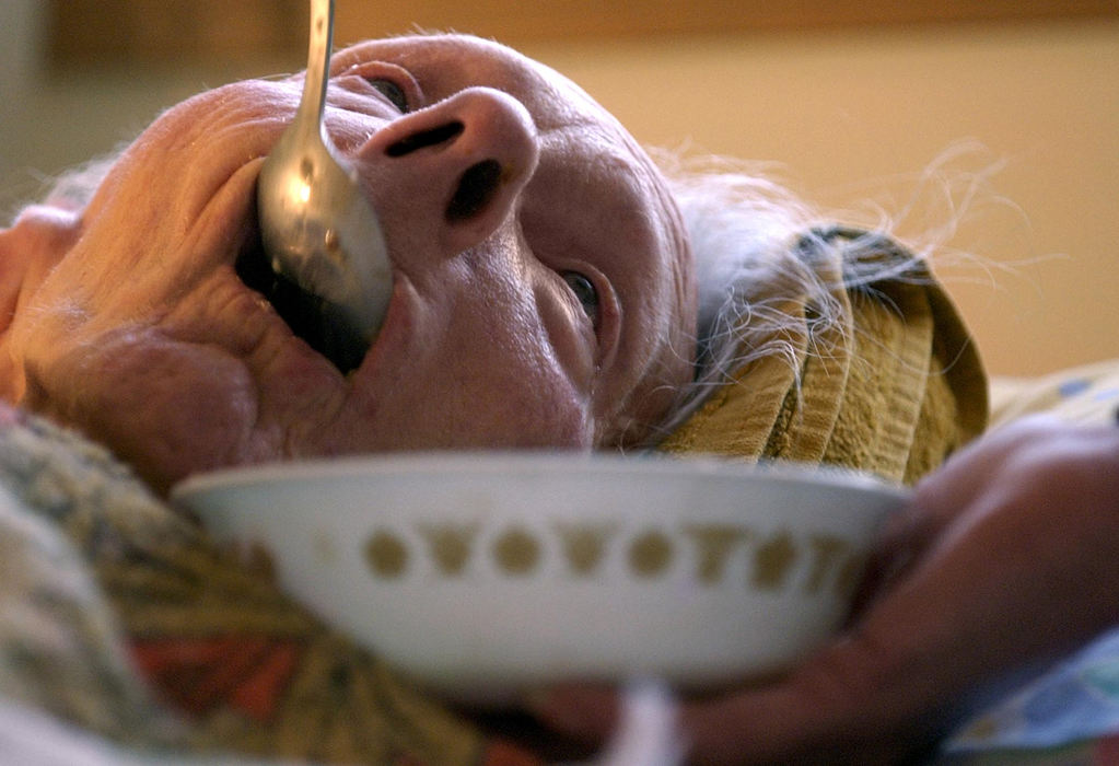 First Place, Student Photographer of the Year - Haraz Ghanbari / Kent State UniversityEvelyn Shaw eats her breakfast, Dec. 27, 2003 in North Ridgeville. Shaw's husband, Dudley, prepares meals for her daily and uses a blender to make her meals easier to swallow. 