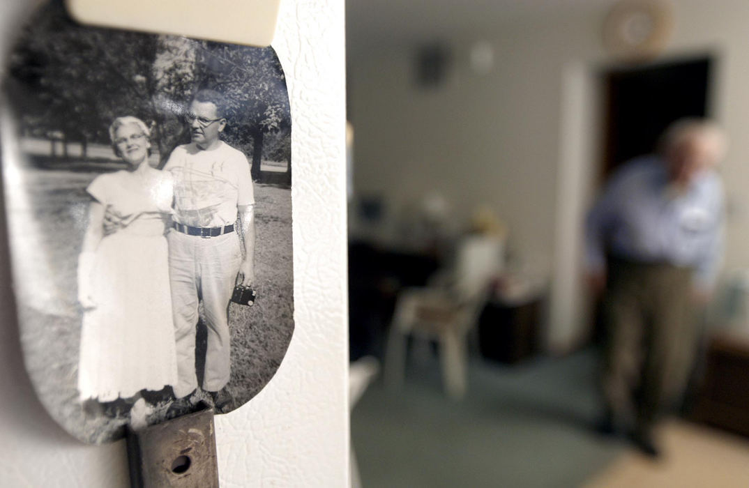 First Place, Student Photographer of the Year - Haraz Ghanbari / Kent State UniversityA black and white photograph of Evelyn and Dudley Shaw hang on their refrigerator door, Dec. 27, 2003 in North Ridgeville. Evelyn was diagnosed  with Alzheimer's Disease in 1992 and has been confined to a bed since 1994. Dudley spends his days taking care of his wife. 