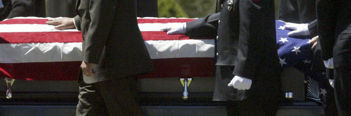 Second Place, Student Photographer of the Year - Scott R. Galvin / Kent State UniversityPaulbearers walk the flag-drapped coffin of Youngstown Police Officer Michael Hartzell to the grave May 3, 2003, in Youngstown. Hartzell was shot in the line of duty.