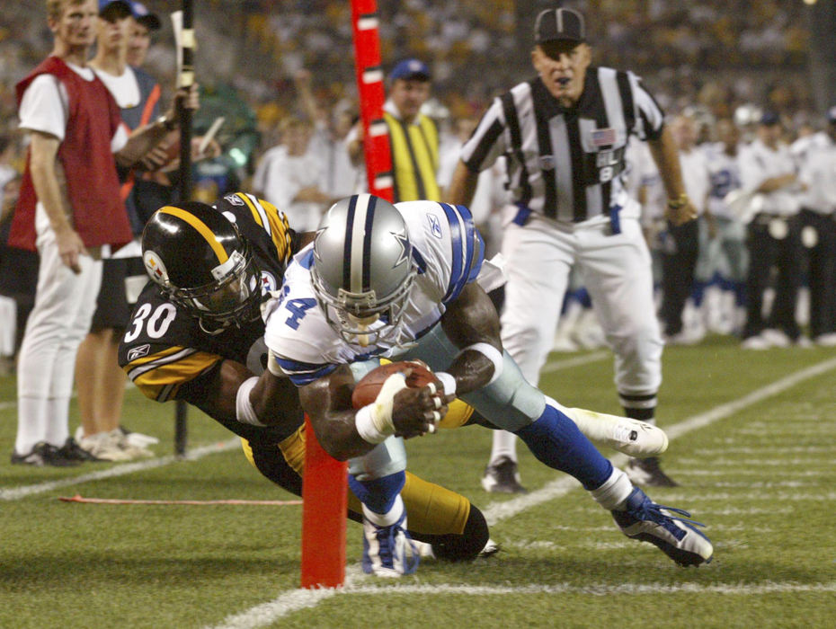 Second Place, Student Photographer of the Year - Scott R. Galvin / Kent State UniversityPittsburgh Steelers' Chad Scott brings down Dallas Cowboys' wide receiver Joey Galloway as he scores a touchdown in the first-half at Pittsburgh August 21, 2003.