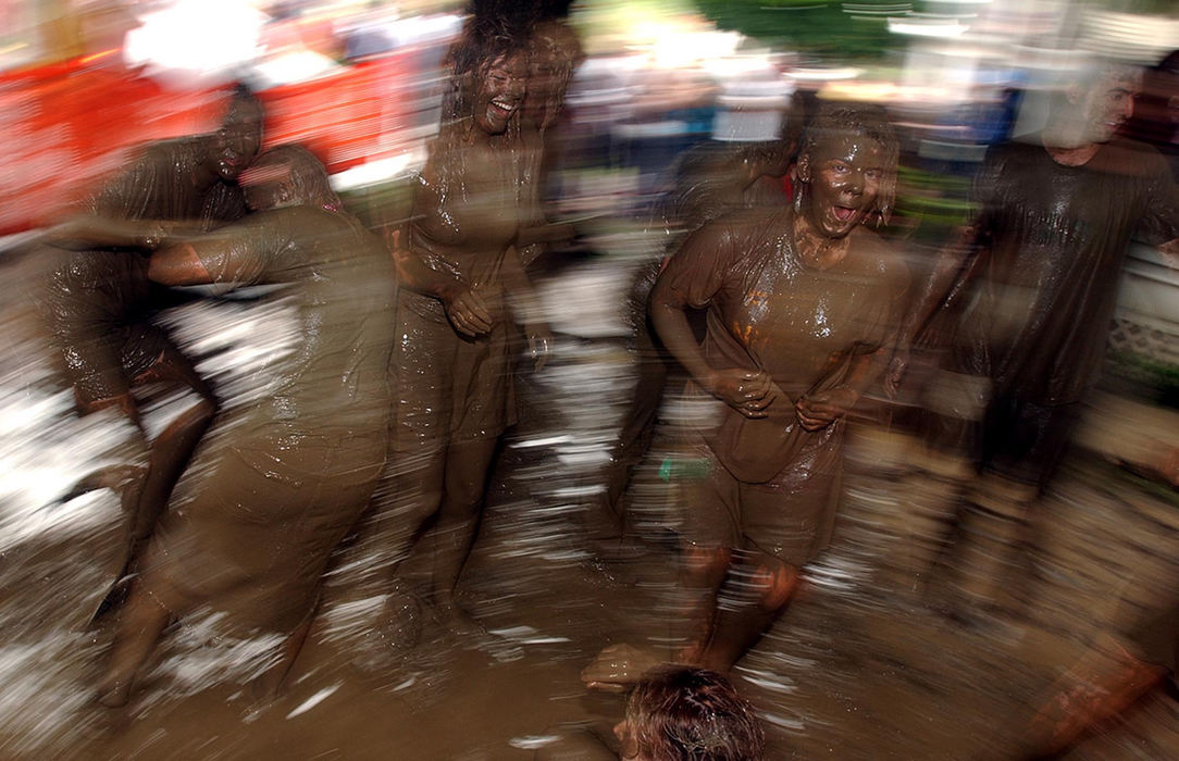 Third Place, Student Photographer of the Year - Robert Caplin / Ohio UniversityOhio University students mud wrestle after a rainstorm hit Athens during, Palmerfest, an annual street festival in Athens. 