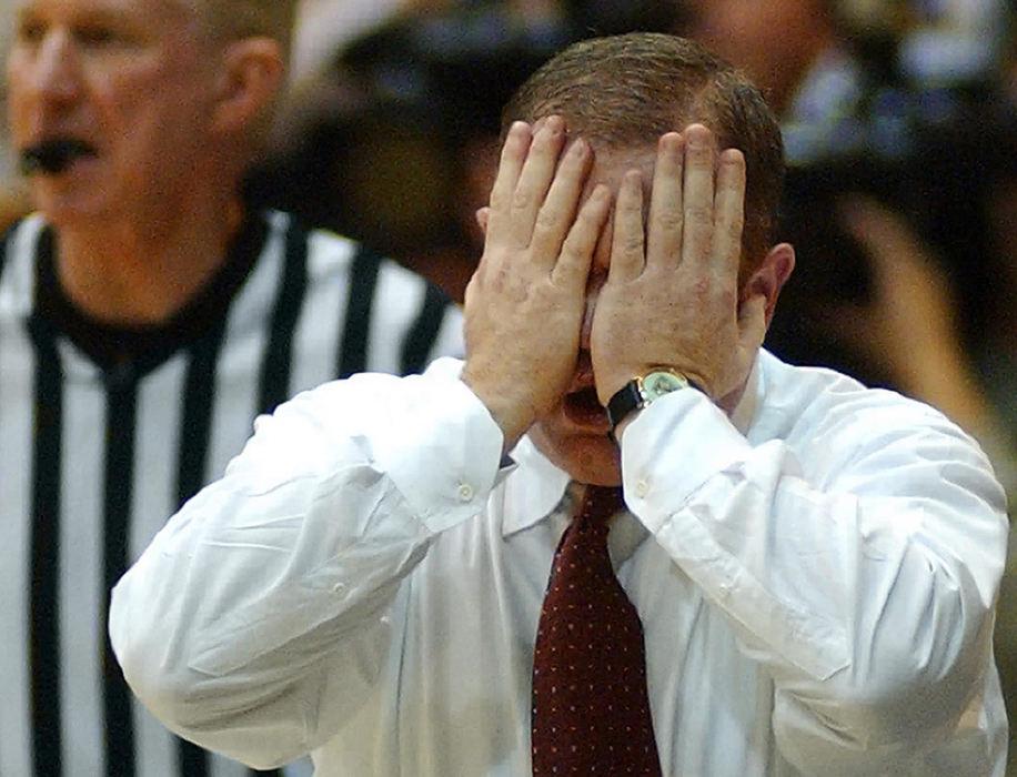 First Place, Student Photographer of the Year - Haraz Ghanbari / Kent State UniversityCollege of Charleston coach Tom Herrion, reacts to a call during the first half of play against Kent State during their NIT game, March 19, 2003, in Kent. 