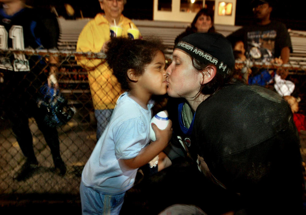 First Place, Sports Picture Story - Fred Squillante / The Columbus DispatchThe Flames' Susan Nelson gets a kiss from her daughter, Savannah, 3, following a game against the D.C. Divas. 