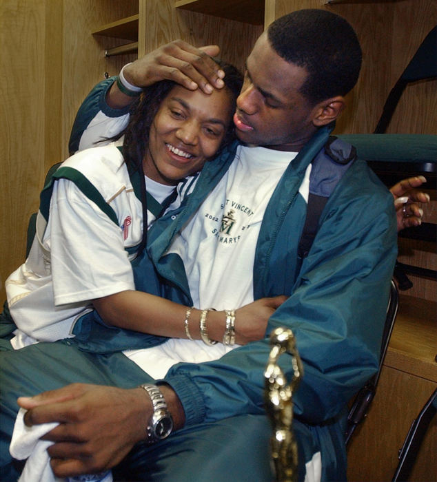 Second Place, Sports Picture Story - Phil Masturzo / Akron Beacon JournalLeBron James gets a hug from his mom Gloria James, a single parent wo gave birth to LeBron her senior year in high school. Gloria would be the center of controversy as she purchased a $50,000 Hummer for her son's 18th birthday.