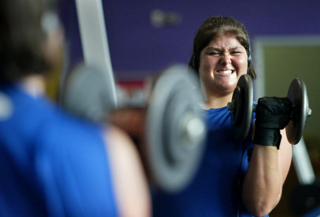 First Place, Sports Picture Story - Fred Squillante / The Columbus DispatchTiff Wheeler, starting center for the Columbus Flames, hits the weights. She has gladly endured such workouts in pursuing her dream of playing football.