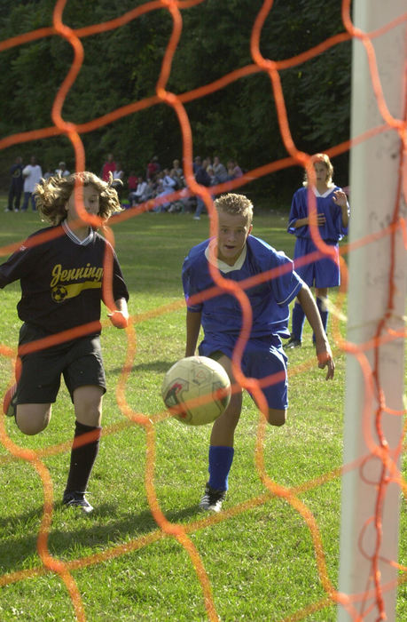 Third Place, Sports Picture Story - David Distelhorst / Akron Beacon JournalSandro scores his third goal during a 4-1 victory over Jennings Middle School.