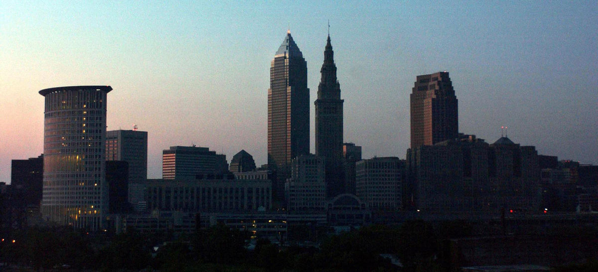 Second Place, Team Picture Story - Marvin Fong / The Plain DealerOn Aug. 14, 2003, the largest blackout to ever hit North America left 50 million people from Toronto to New York without power.  The massive failure put Clevelanders in the dark as well, causing a state of emergency with commuter gridlock, stranded travelers and depleted water supplies.The skyline of Cleveland at dusk during the power outage, August 14, 2003.