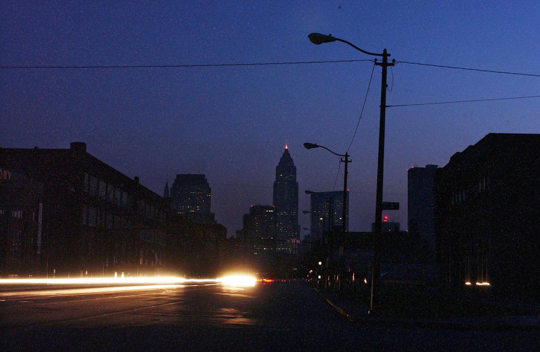 Second Place, Team Picture Story - Mike Levy / The Plain DealerA darkened Superior Avenue in downtown Cleveland was a test for drivers who only had their headlights to show the way.