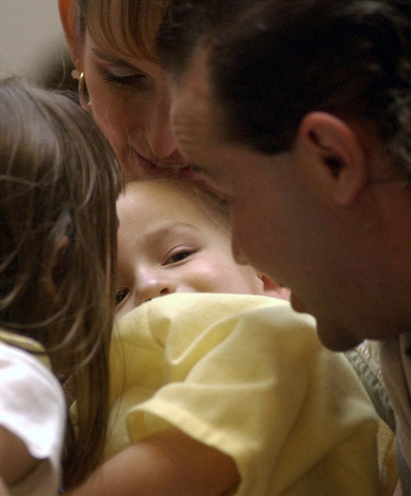 Award of Excellence, Team Picture Story - Daniel Melograna / The News JournalThe Ervin Family huddle around Luke after he wakes up from his MRI May 16 at Children's Hospital in Columbus.