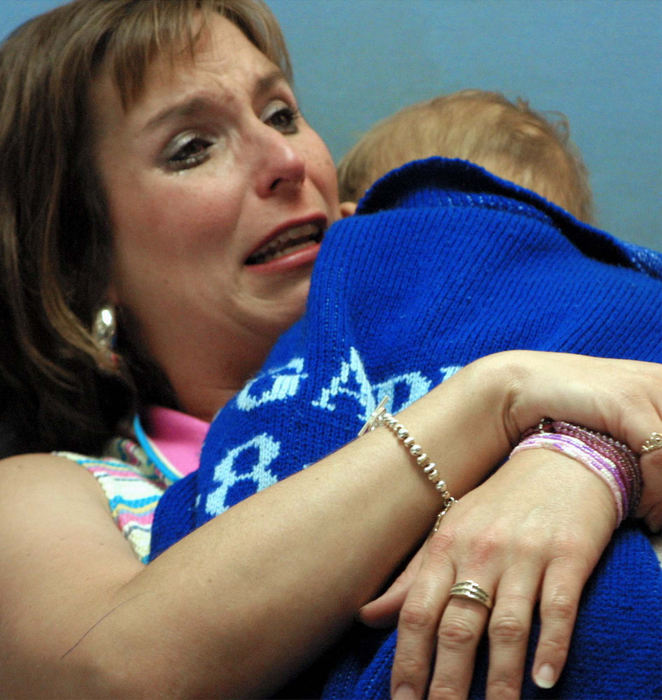 Award of Excellence, Team Picture Story - Mitchell Masilun  / The News JournalIvy Ervin cries as she talks to her husband, Monte, about whether they should try another operation to possibly prolong Luke's life.