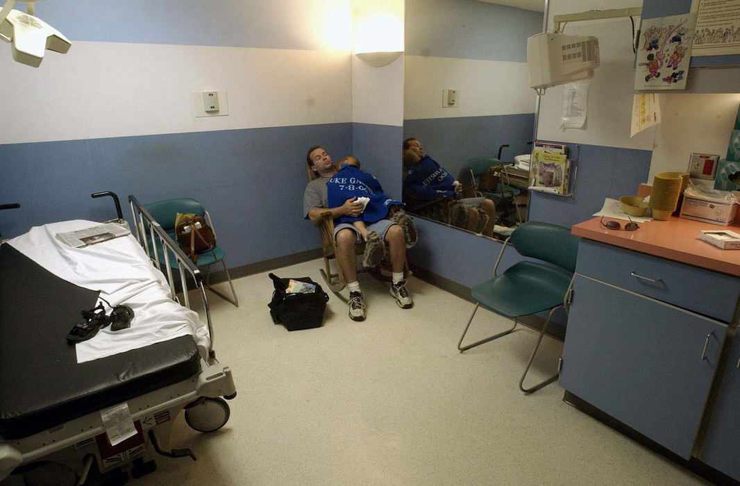 Award of Excellence, Team Picture Story - Mitchell Masilun  / The News JournalMonte Irvin holds Luke while awaiting the results of a CAT Scan at Childrens hospital in Columbus on July, 12