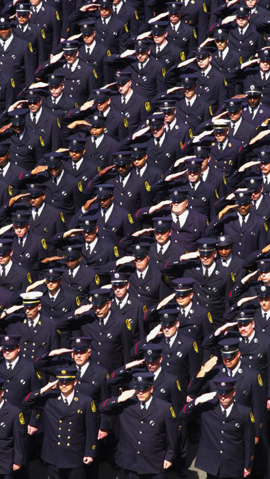 First Place, Team Picture Story - Glenn Hartong / Cincinnati EnquirerHundreds of firefighters attended the funeral for Oscar Armstrong, here is a mass salute as the casket is taken onto the church.                              