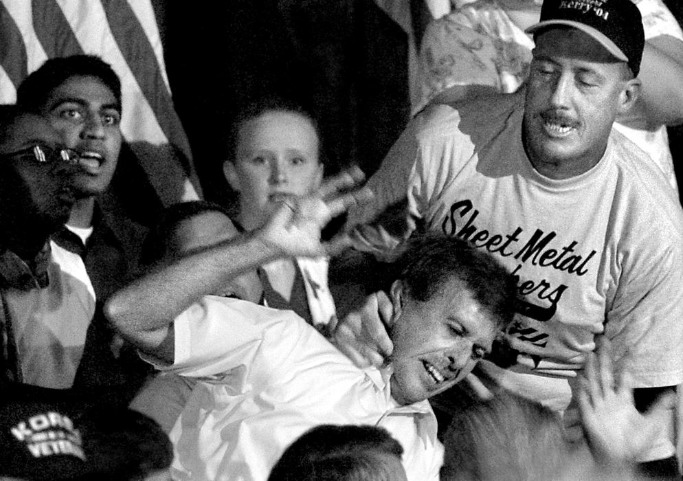 First Place, Campaign 2004 - Michael E. Keating / Cincinnati EnquirerA heckler to Presidential candidate John Kerry is slapped to the ground by a union member during a speech.