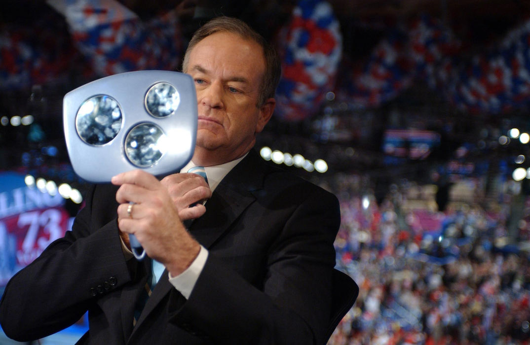 Award of Excellence, Campaign 2004 - Lisa Marie Miller / Reuters Fox News commentator Bill O'Reilly checks himself in a mirror before an interview at the Republican National Convention in New York on September 1, 2004.  