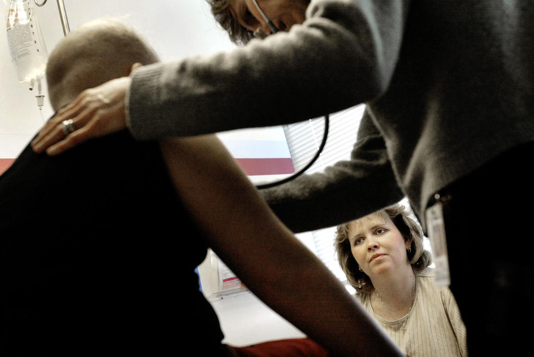 Second Place, Feature Picture Story - Fred Squillante / The Columbus DispatchAbbie's mom, Sherrie, watches as nurse practitioner Carla Hughes examines Abbie. 
