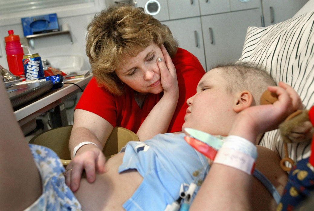 Second Place, Feature Picture Story - Fred Squillante / The Columbus DispatchSherrie comforts Abbie during an extended stay at Children's Hospital. Abbie said she wasn't feeling well. 