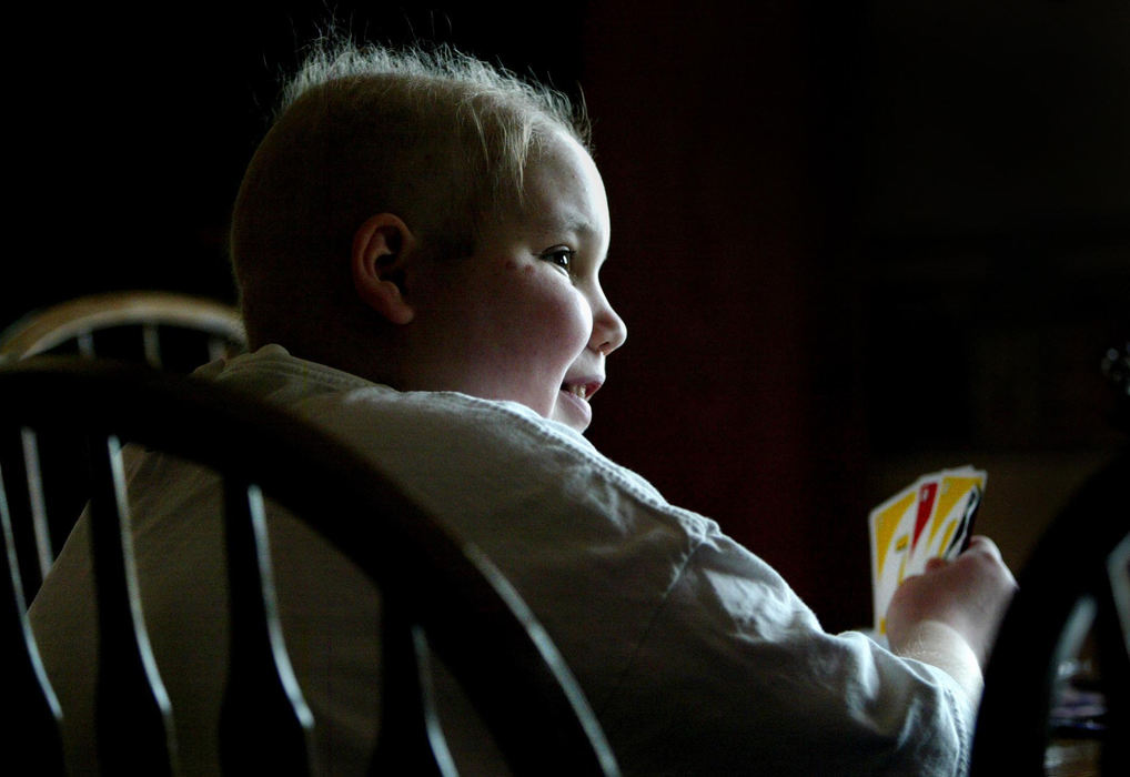 Second Place, Feature Picture Story - Fred Squillante / The Columbus DispatchAbbie, playing UNO in her home, faces another year of treatment.