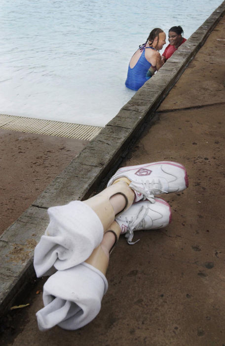 First Place, Feature Picture Story - Gus Chan / The Plain DealerChrissy Aitken, 15, and Tashawna Walthauw, 13, splash each other while playing in the water at Geauga Lake/Six Flags, August 26, 2004. 