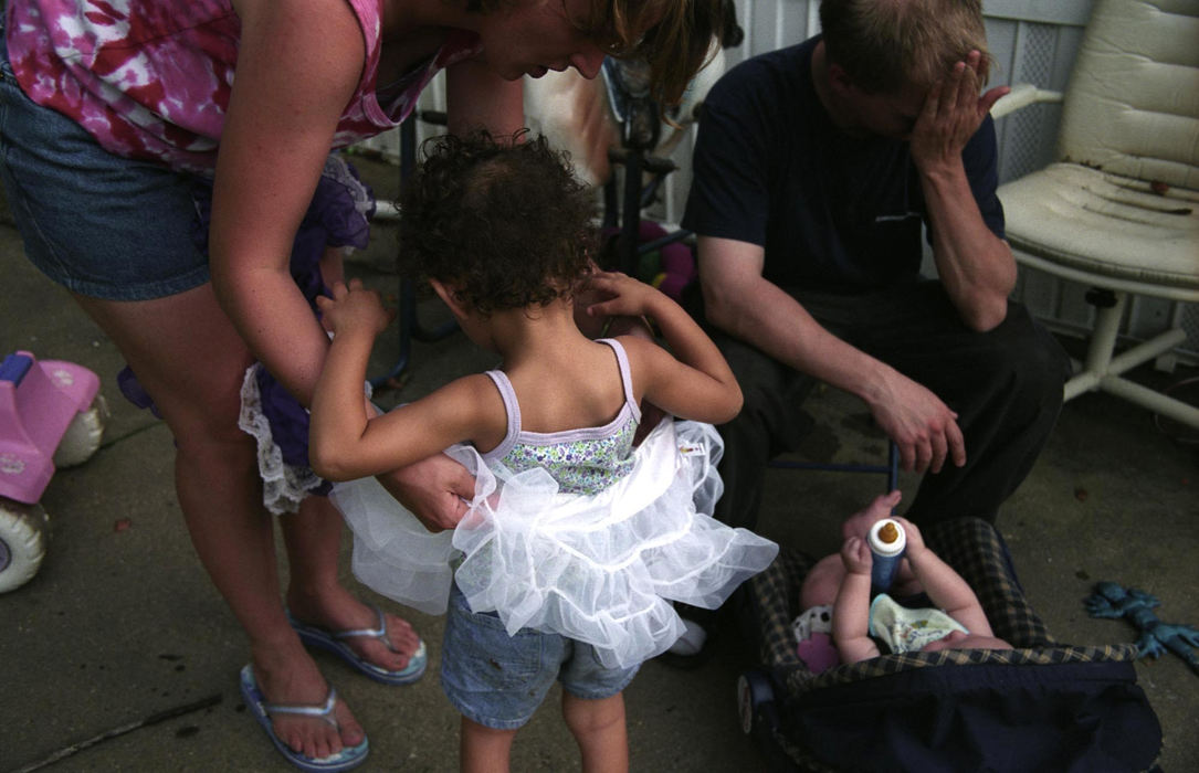 Third Place, Feature Picture Story - Samantha Reinders / Ohio UniversityGreg works the night shift at a nearby gas station. Fatherhood duties, however, keep him from sleeping during the day. While his wife readies his eldest daughter for a local beauty pageant - he has to look after his youngest child.