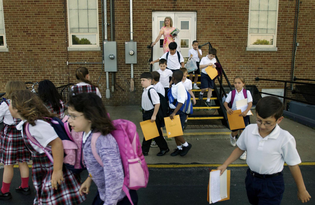 Award of Excellence, Feature Picture Story - Gus Chan / The Plain DealerPauline Miller follows her second grade class over to the church as they head over to the school's final mass and awards ceremony, June 4, 2004.   