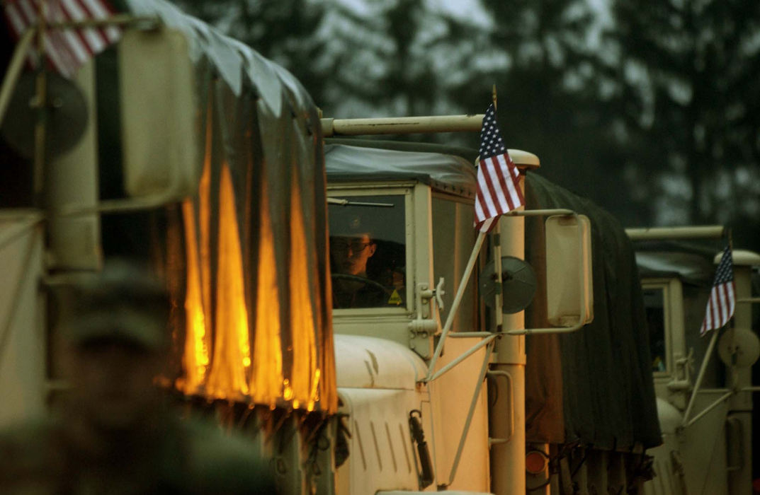 Award of Excellence, Feature Picture Story - Eustacio Humphrey / The Plain DealerSpc. Kristin Kretzler drives a five-ton truck Monday, January 5, 2004 with the Ohio Army National Guard 1484th Transportation Company on their deployment assignment to Indiana where they will train and prepare for approximately five weeks before they go to the Middle East to fight the war on terrorism.