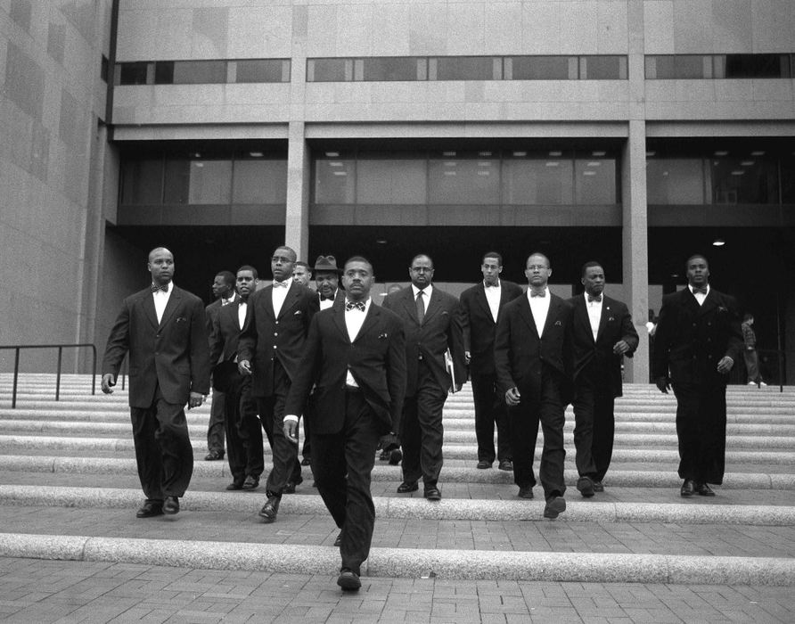 Award of Excellence, Feature Picture Story - Eustacio Humphrey / The Plain DealerFruits of Islam of Mosque #18 accompany Minister Richard Muhammad (second from left), leader of the mosque, Minister Jamil Muhammad, (behind Richard) national spokesman of the Nation of Islam and general counsel for Louis Farrakhan, Abdul Arif Muhammad (background center) as they walk out of the Justice Center. Municipal judge Mabel Jasper dropped the charges against seven members of the Nation of Islam accused of dragging a man from his home and beating him during a search for 11-year-old Shakira Johnson.