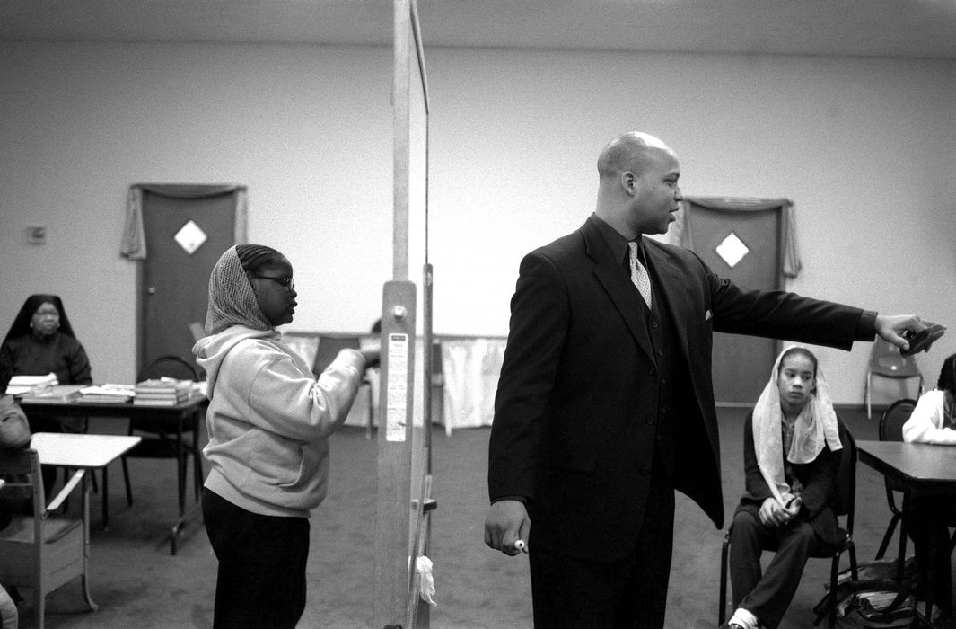 Award of Excellence, Feature Picture Story - Eustacio Humphrey / The Plain DealerCurtis Muhammad teaches a lesson on Islamic Studies to students in the fifth to eighth grade at Muhammad University of Islam Mosque #18. In Cleveland, the school curriculum started two years ago as a non-accredited K-8th grade school. In 2003, the school graduated its first 8th grader. 