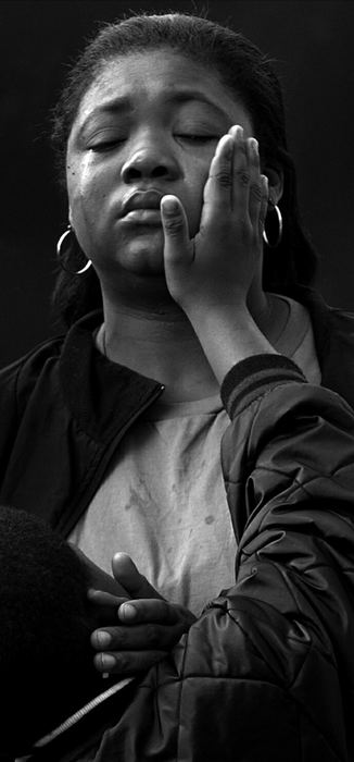 First Place, General News - Andy Morrison / The BladeKemon Thornton, 6, wipes away the tears of his mother Lakeisha Hopings after leaving a stuffed animal in front of an apartment where seven children died in a fire. Hopings said Kemon was a classmate of Terri Sanders who was killed in the blaze.