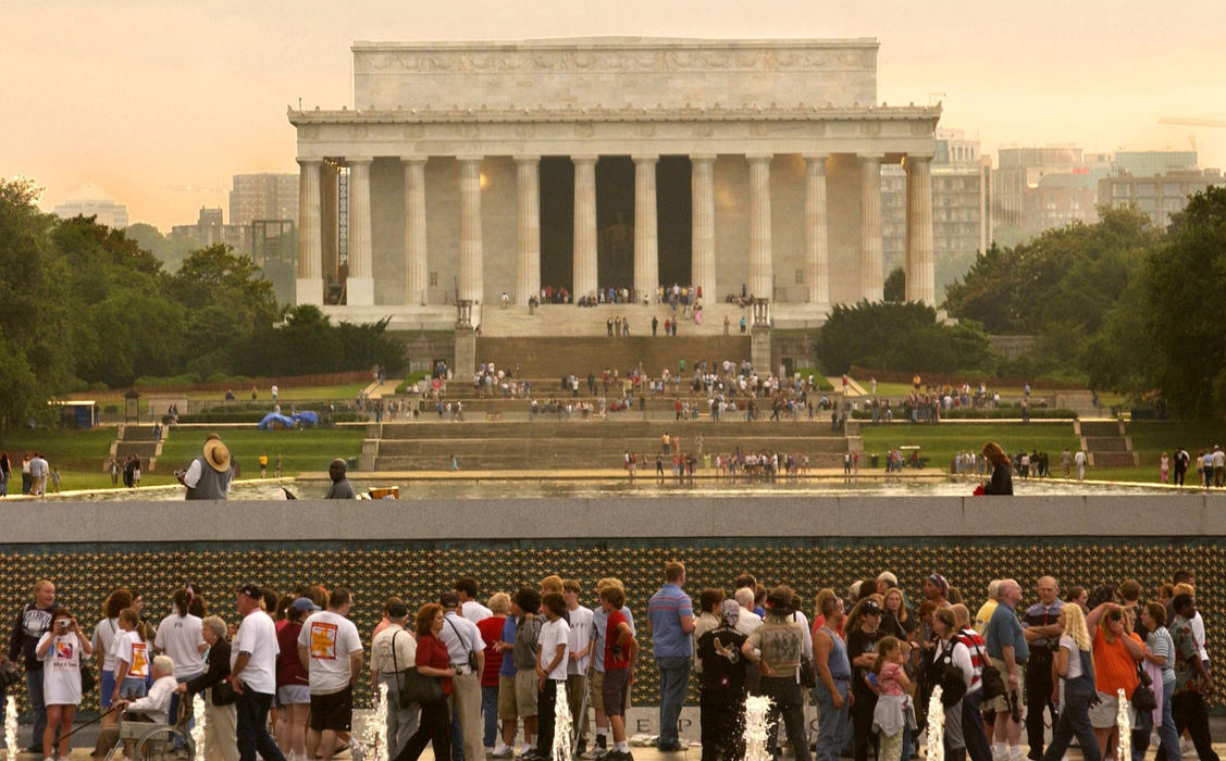 First Place, News Picture Story - Joshua Gunter / The Plain DealerHundred of thousand of WWII veterans crowded into Washington D.C. for the dedication of the WWII Memorial. It was a weekend of joy and tears. Some vets reunited with each other after years apart, sharing stories with loved ones that they had never told anyone until this day. Visitors tour the World War II Memorial, May 28, 2004 in Washington D.C.  