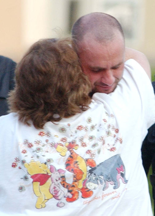 Award of Excellence, News Picture Story - Warren Dillaway / The Star BeaconPaul Ganyard hugs his mother after surrendering to police after a two hour standoff. He was wanted on an outstanding warrant and threatened that he would not be taken alive.