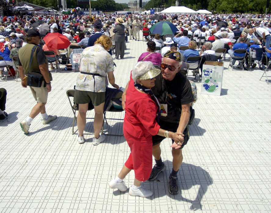 First Place, News Picture Story - Joshua Gunter / The Plain Dealer79-year-old Larry Goldgeier and his 78-year-old wife Anne dance to the music of their generation during a tribute ceremony before the dedication ceremony of the World War II Memorial, May 29, 2004 in Washington D.C. The couple are from Boca Raton, Fla. Larry served in the Eight Armored Division from 1943 to 1946. 