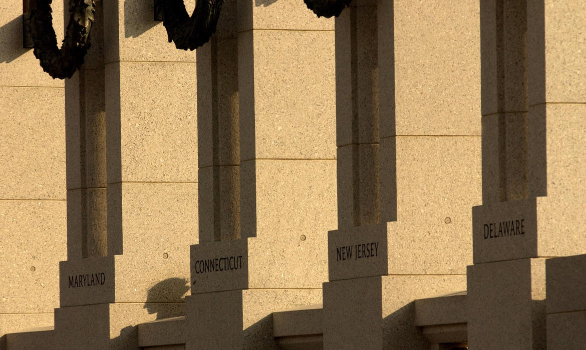 First Place, News Picture Story - Joshua Gunter / The Plain DealerA low sun setting over the World War II War Memorial casts a shadow on one of the 56 pillars, May 28, 2004 in Washington D.C.  