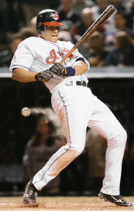 First Place, Photographer of the Year - John Kuntz / The Plain DealerCleveland Indians Victor Martinez is hit by a pitch off of Chicago White Sox pitcher Shingo Takatsu in the 7th inning at Jacob's Field May 19, 2004 in Cleveland.  The puff of white is the dust off of Martinezes leg. 