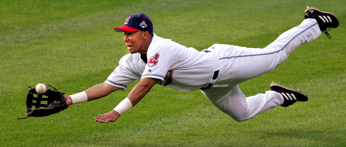 Third Place, Photographer of the Year - Joshua Gunter / The Plain DealerCleveland Indians RF Jody Gerut attempts a diving catch at a ball off of Chicago White Sox DH Carl Everett in the first inning, July 21, 2004 at Jacobs Field in Cleveland. 