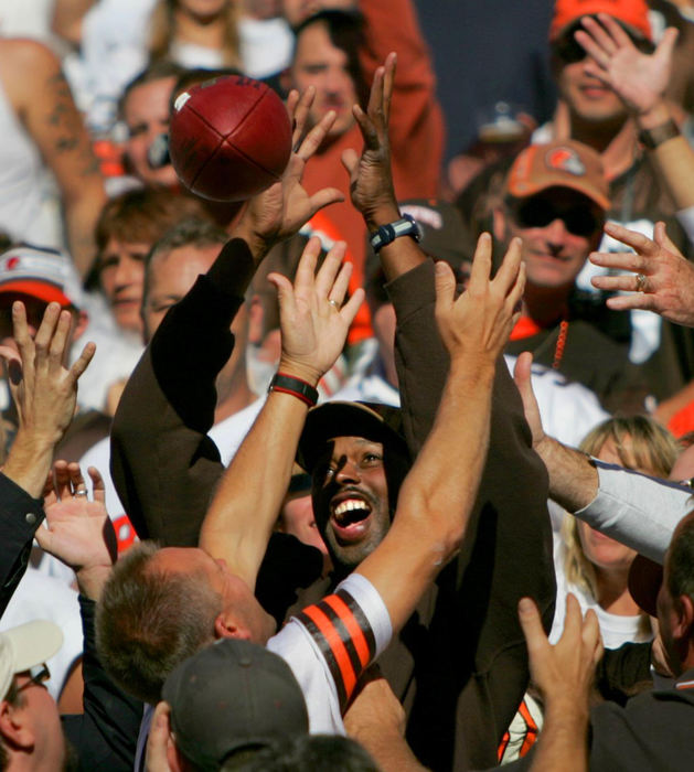 Third Place, Photographer of the Year - Joshua Gunter / The Plain DealerFans fight for a ball thrown into the stands by Washington Redskins QB Mark Brunell after Brunell was put under pressure by Cleveland Browns players, October 03, 2004 at Cleveland Browns Stadium in Cleveland. 