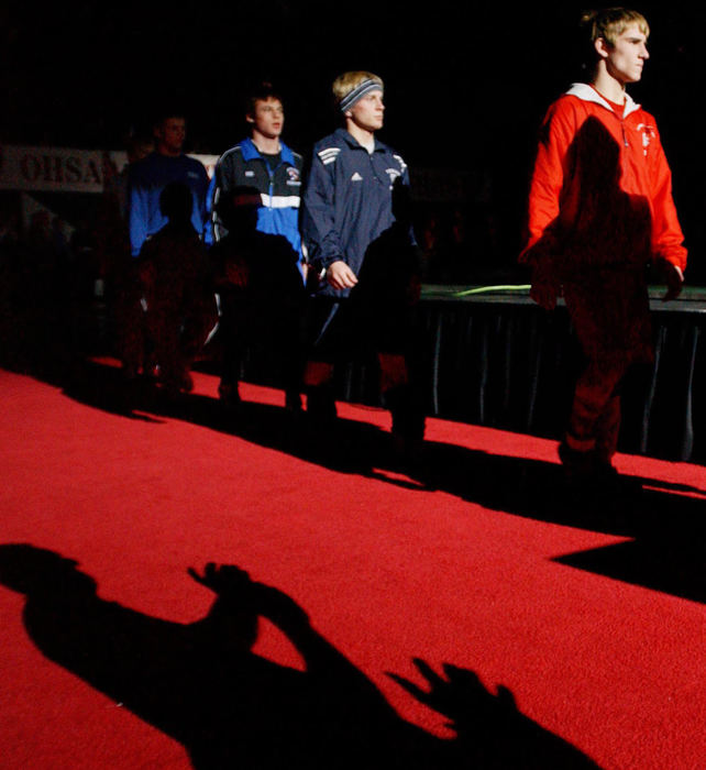 First Place, Photographer of the Year - John Kuntz / The Plain DealerThe state championship wrestlers make their way out to the mats in the parade of champions before the start of the 67th OHSAA's state wrestling championships February 28, 2004 in Columbus.  