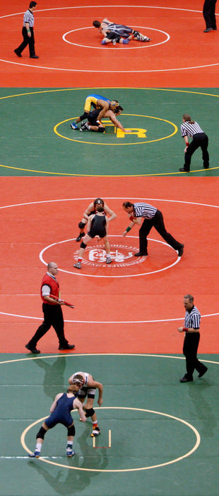 First Place, Photographer of the Year - John Kuntz / The Plain DealerFour of the ten mats are constantly occupied with high school wrestlers all over the state of Ohio during the state championship high school wrestling tournament in Columbus.