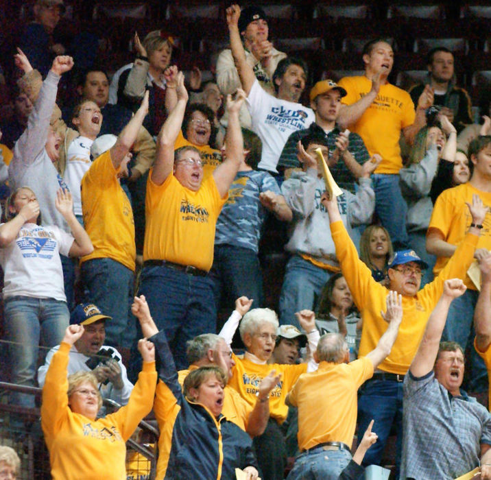 First Place, Photographer of the Year - John Kuntz / The Plain DealerThe fans supporting Clyde High School erupt out of their seats when their Division II 140lb. wrestler Jon Taylor beat Owen Powell from Camden Preble Shawnee to keep his state championship hopes alive in the quarterfinal match February 27, 2004 in Columbus.