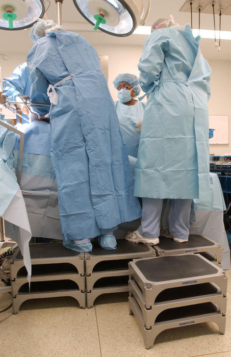 First Place, Photographer of the Year - John Kuntz / The Plain DealerThe doctors and operating room nurses at St. Vincent Charity have to use step ladders to get high enough to work on Chip who weighed in at 357 pounds before his surgery.